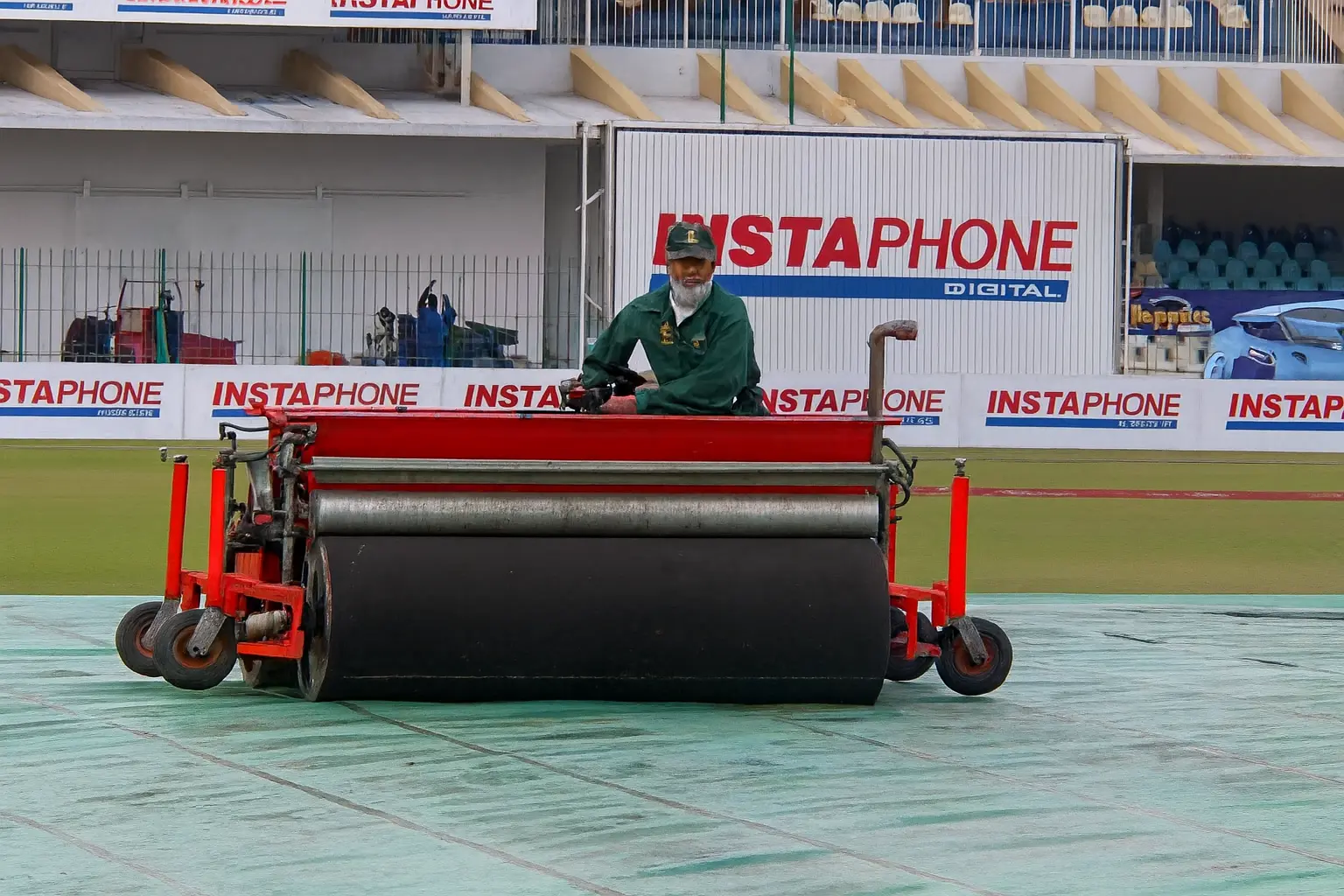 Groundsman operating an early locally-engineered Super Sopper at a Pakistan cricket stadium, demonstrating Liberal Lawn Mowers’ 2008 breakthrough in wet-pitch management for the PCB.