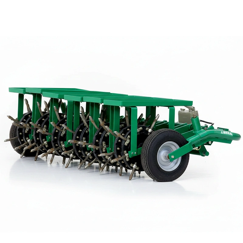 Liberal Spike Master aerator machine attached to Millat's MF 235 tractor for heavy-duty lawn aeration.